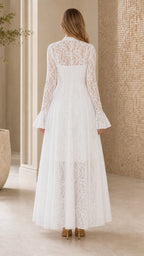 Back view of white lace maxi dress showing flared sleeves