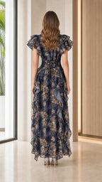 Back view of navy floral maxi dress showing lace-up detail
