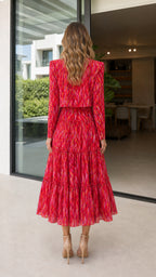 Back view of model in red abstract print midi dress