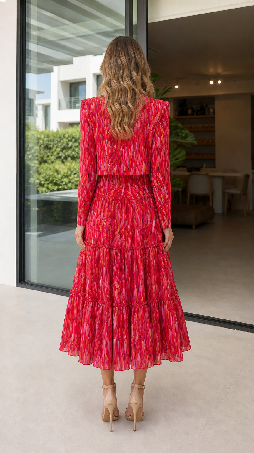 Back view of model in red abstract print midi dress