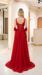 Back view of woman in red formal gown showing back neckline and draping