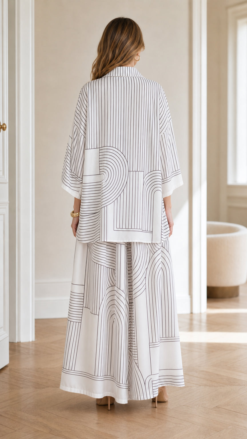 Back view of model wearing white shirt and wide leg pants