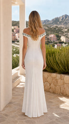 Back view of woman wearing white evening gown