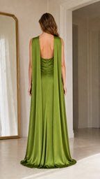 Back view showing flowing drape panels on olive green maxi dress