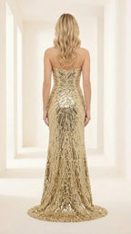 Back view of the gold sequin evening gown showing sweep train