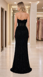 Back view of woman in floor-length black evening dress