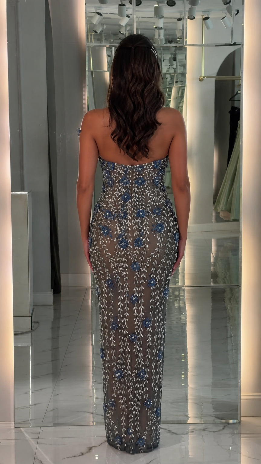 Back view of blue beaded evening gown