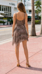Back view of model showcasing asymmetrical hemline