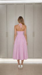 Back view showing halter neck tie and open back