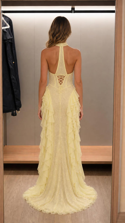 Back view showing lace-up corset detail of yellow maxi dress