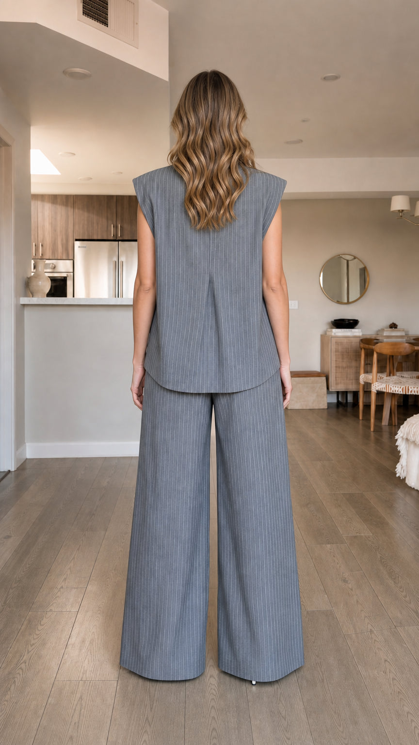 Back view of model wearing grey pinstripe matching set