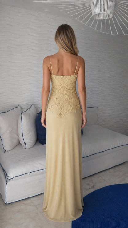 Back view of yellow spaghetti strap evening gown