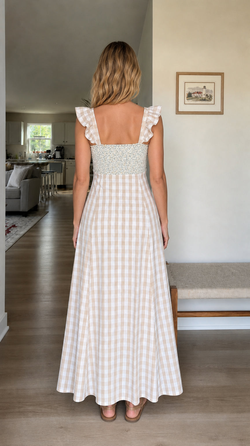 Back view of woman wearing beige gingham maxi dress