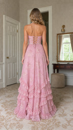 Back view of model showing lace-up corset detail on pink maxi dress