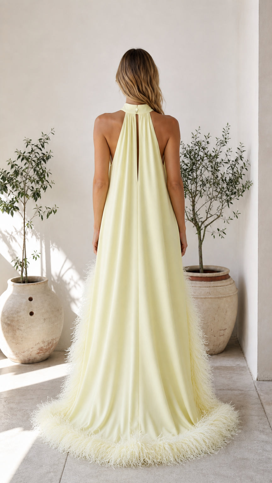 Back view showing high neckline and train of yellow dress