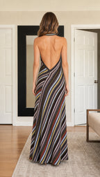 Back view showcasing open-back design of black maxi dress