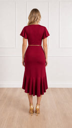 Back view of burgundy midi dress with fitted silhouette