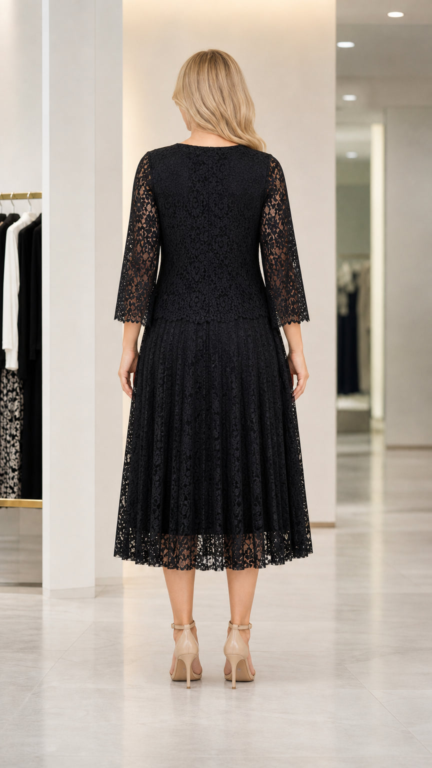 Back view of woman wearing black lace midi dress