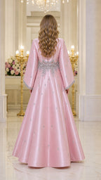 Back view of model in pink long sleeve maxi dress