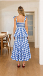 Back view of blue gingham midi dress with tie straps