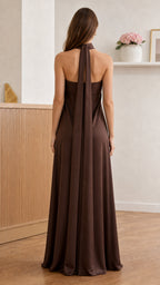 Back view of brown maxi dress showing halter scarf detail