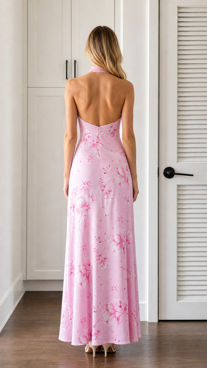 Back view showcasing open back design of pink floral maxi dress
