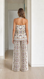 Model wearing cream boho printed two-piece set, back view