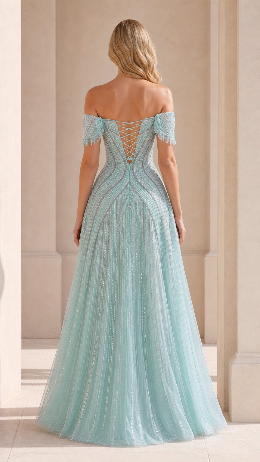 Back view showing lace-up corset detail on mint gown