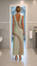Back view showcasing scoop back detail of mint sequin dress
