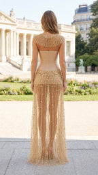 Back view showing structured back and sheer skirt of gold gown