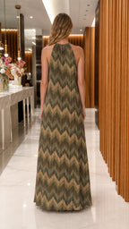 Back view of model wearing green metallic chevron maxi dress