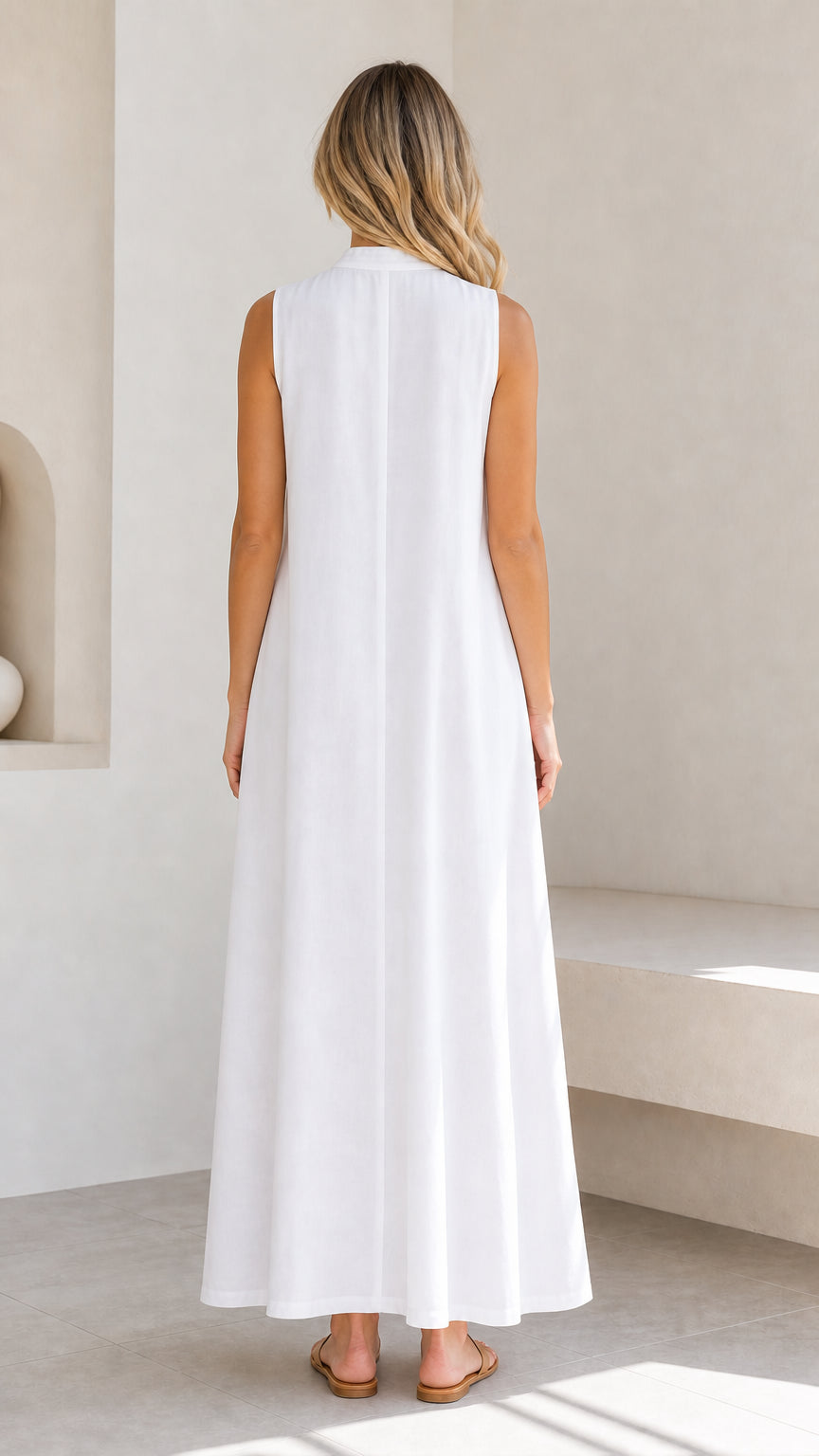 Back view of a woman wearing a white sleeveless maxi dress