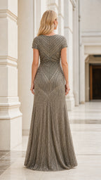 Back view showing detailed beadwork on taupe evening dress