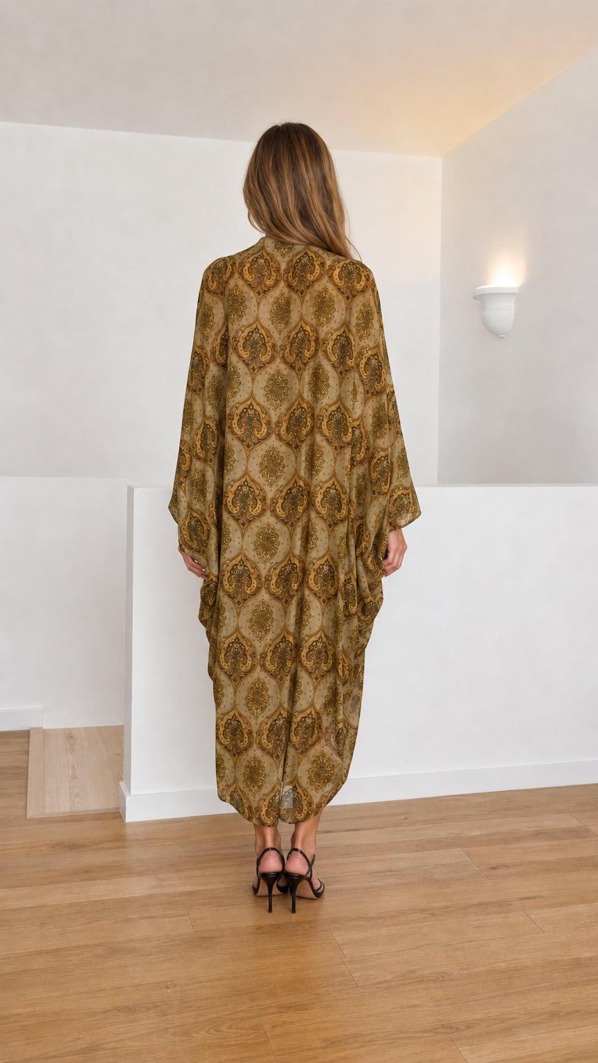 Model wearing olive paisley kaftan dress back view