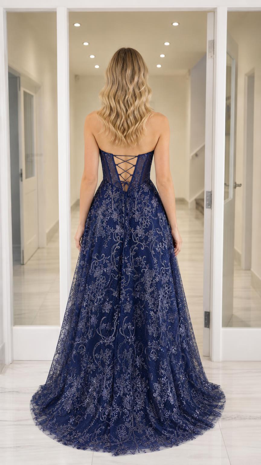Back view showcasing the lace-up corset detail of the navy gown