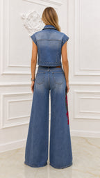 Back view of model showing wide-leg denim trousers