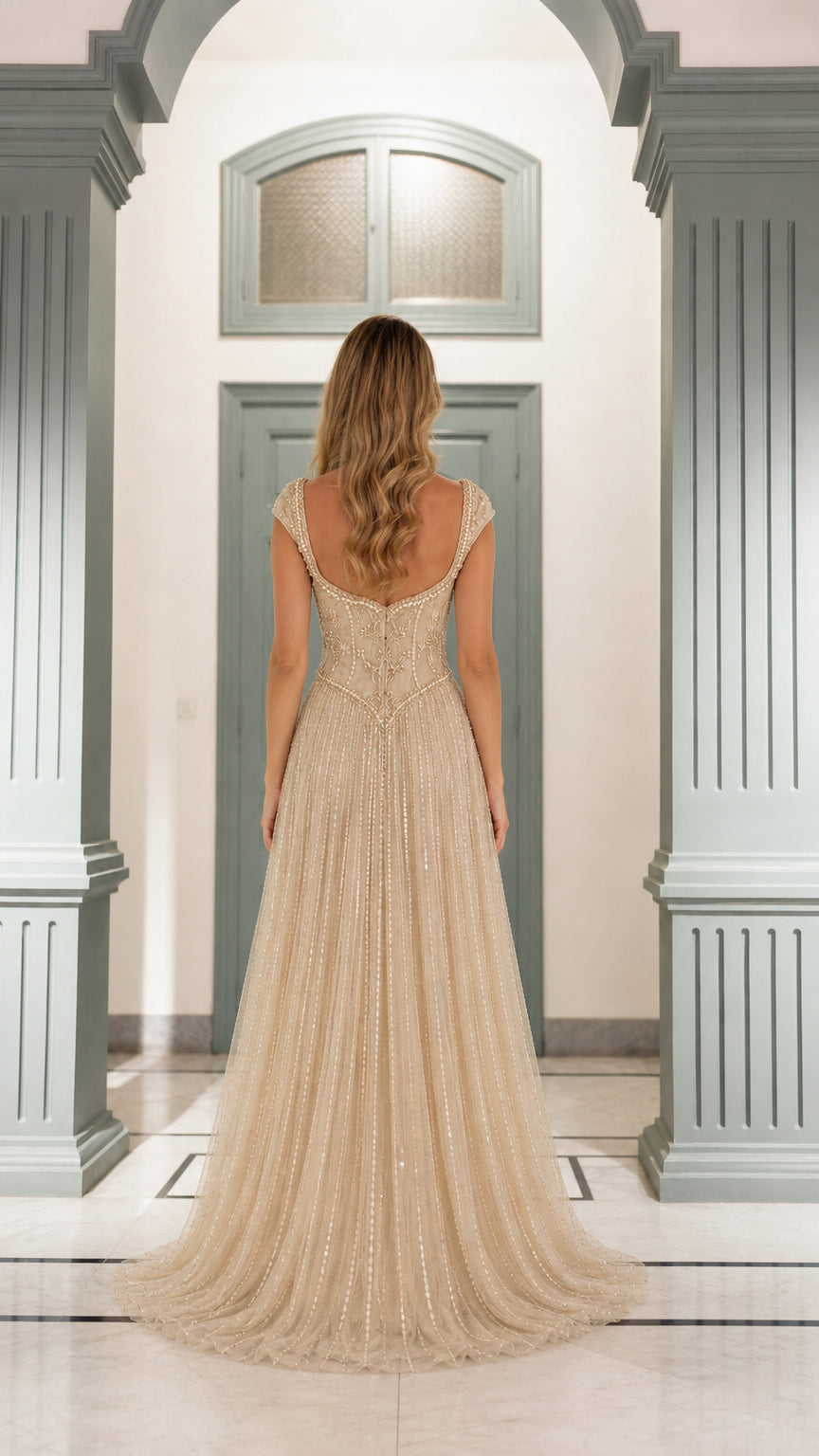 Back view showing sweep train of champagne gown