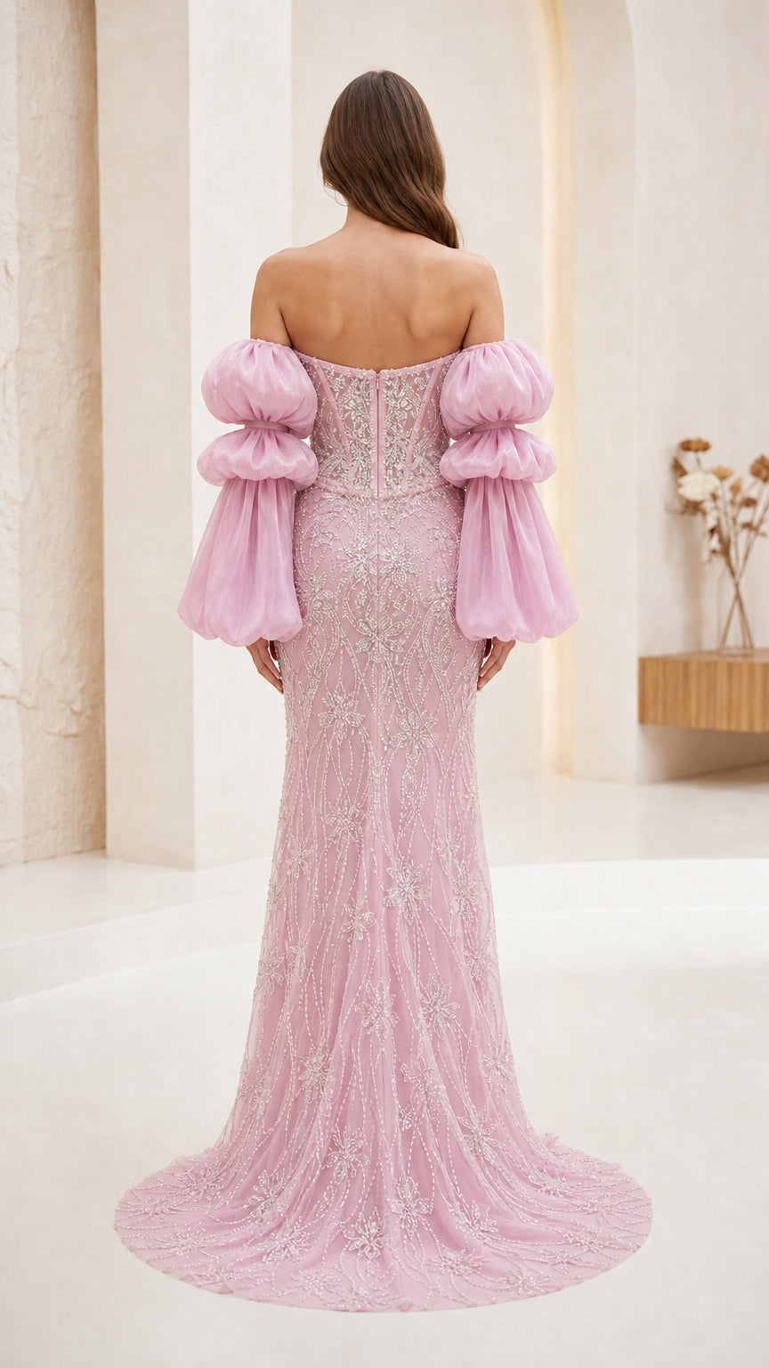 Back view of pink formal gown with sweep train