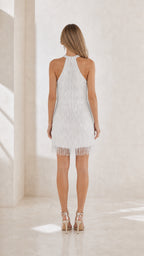 Back view of white halter fringe dress