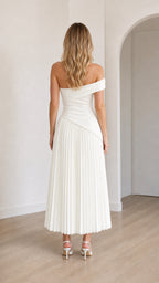 Back view of model in white off-shoulder midi dress