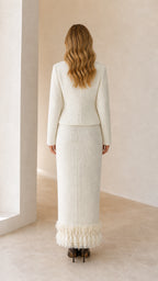Model wearing white tweed set from the back view