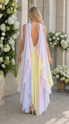 Back view of model showing flowing cape details on multi ombre dress