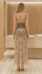 Back view of model in gold formal gown