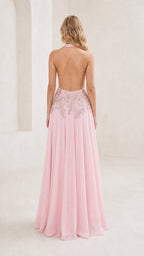 Back view showing open back design of pink gown