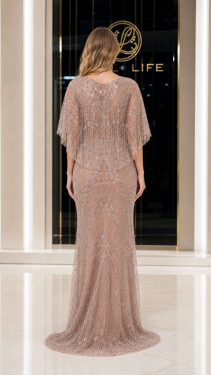 Back view showing sweep train of champagne evening dress