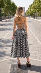 Back view of black and white gingham midi dress showing lace-up detail