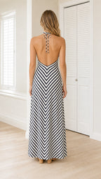 Back view showcasing open back and tie detail of striped maxi dress