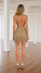 Back view showcasing open back design of the gold beaded mini dress