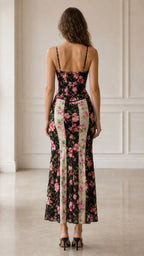 Back view of woman wearing Black floral corset midi dress set