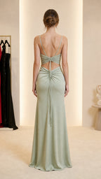 Back view of sage green evening gown showing back cutout and gathering